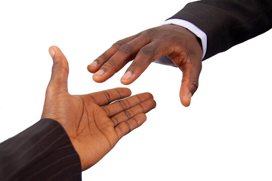 This Is An Image Of A Pair Of Black Business Hands Reaching Out To Each Other. Metaphor For Contract Agreement, Business Help, Employment Opportunities Etc..