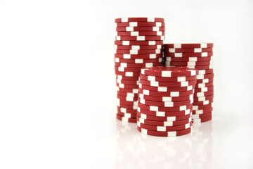 3 part stacks of red casino chips isolated on a white background