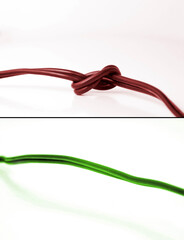 Conceptual photo showing two scenarios: problem and fixed problem. On top is red cable with knot -...