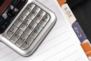 Obraz premium Close up of organizer with mobile phone.