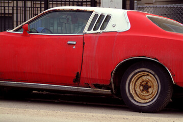 Rusty old red muscle car