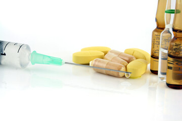 Syringe Pills, and vials on a white background