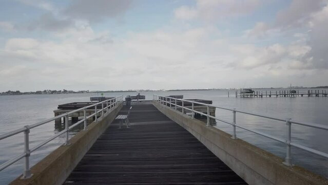  Looking west from the fishing pier at Jungle Prada de Narvaez Park in St. Petersburg, FL. Sunny day wide angle view blue sky with white clouds.
