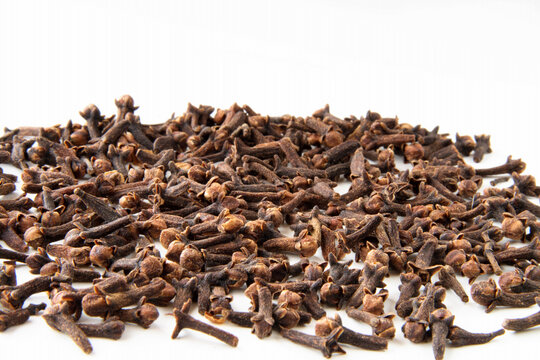 whole cloves spices on white background