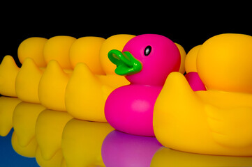 Dare to be different - rubber ducks on black