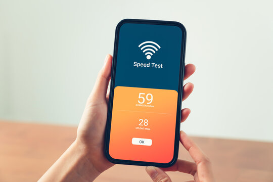Hand using smartphone with showing WIFI speed test and loading bar for download software on internet or data form website.