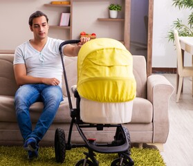 Young male contractor looking after new born at home