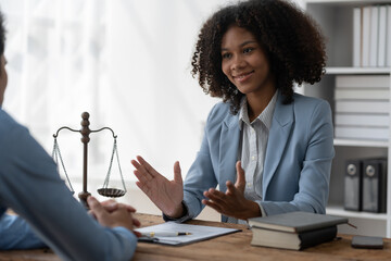 Lawyer or legal advisor reading restrictions Counseling between American female lawyers Africans...