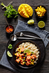 shrimps with beans, mango, brown rice in bowl