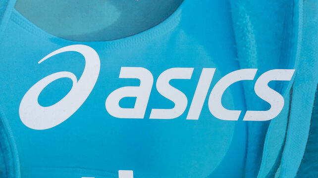 Asics logo brand and text sign facade store Japanese multinational corporation shoes athletic equipment company chain
