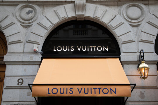 louis vuitton logo brand and sign text front wall facade entrance up store fashion shop