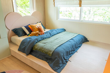 Interior design of blue designed teen boy bedroom.