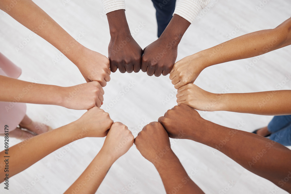 Poster Hands, collaboration and overhead with a business team standing in a circle for unity or solidarity at work. Teamwork, fist bump and support with a diverse group of colleagues in a huddle from above