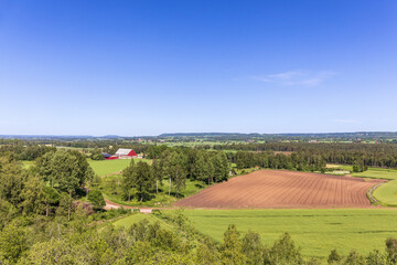 Fields and a red barn in the countryside
