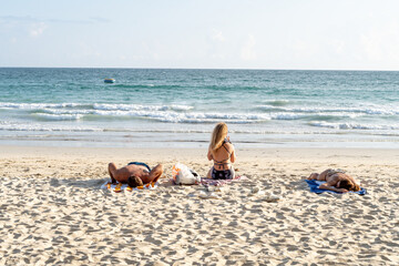 Unidentified tourists enjoying sunbathing at Karon beach in Phuket of Thailand.