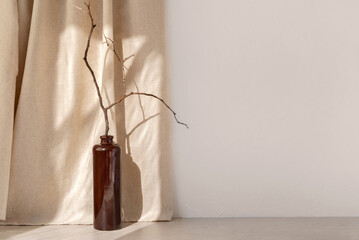 Minimalist template for home room interior product, vase with wooden branch on beige table or...