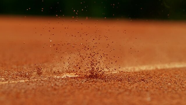 Super slow motion of Tennis ball ping on clay court inside or outside white line. Filmed on high speed cinematic camera at 1000 fps.
