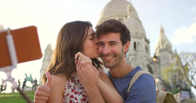 Couple, Paris and selfie at Sacre Coeur, smile and thumbs up for social media, video call and happy. Young man, woman and photography for profile picture, travel blog and romantic holiday in France