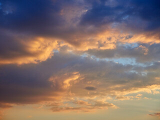 Naklejka na ściany i meble Beautiful clouds in the blue sky during sunset