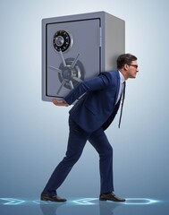 BUsinessman stealing metal safe from bank - obrazy, fototapety, plakaty
