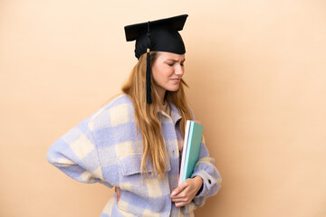 Young student woman over isolated background suffering from backache for having made an effort