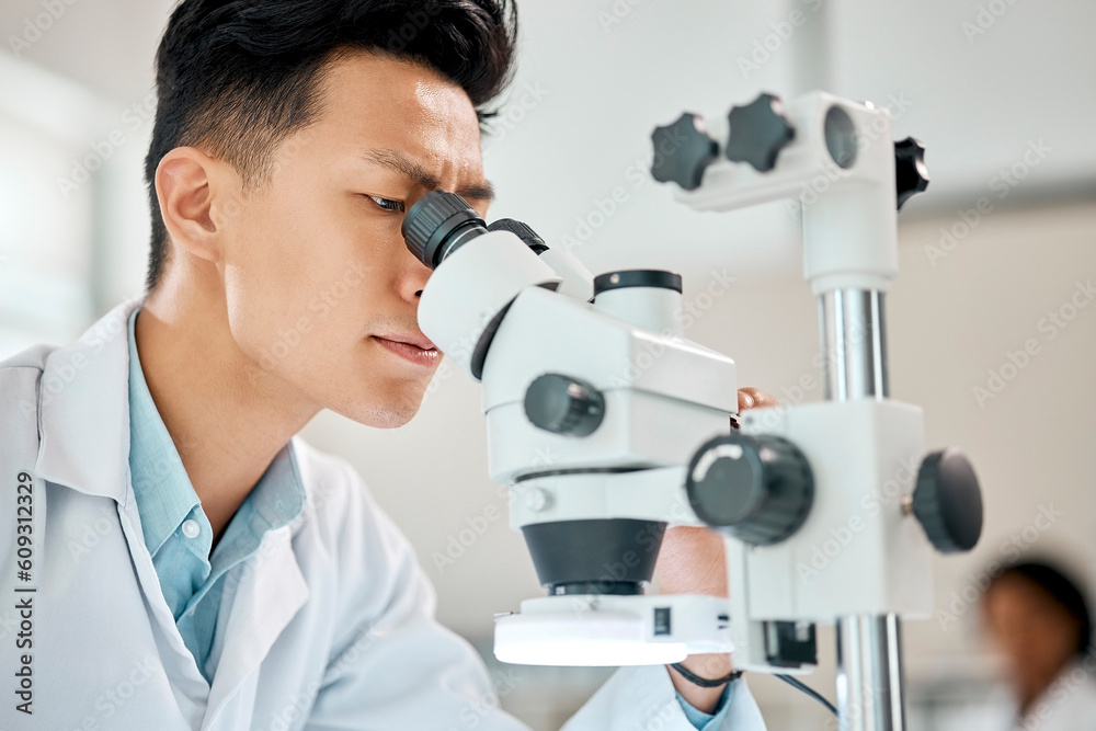 Poster medical, science and microscope with an asian man doctor working in a lab for research or innovation