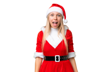 Young blonde woman with christmas hat over isolated chroma key background with surprise facial expression