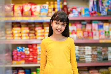 Indian girl purchasing at grocery shop