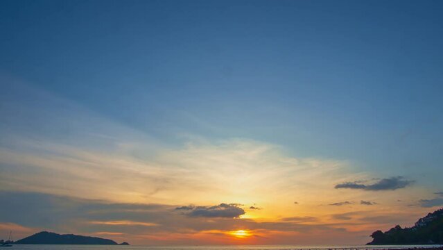 .time lapse reflection of sunset in water trapped in rocks..beautiful sunset at Kalim beach fishing boats in the sea..Kalim beach is conected to Patong beach there have a lot of reef and rocks.