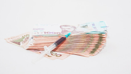 Dollars and shackles with drugs on a beautiful background close-up
