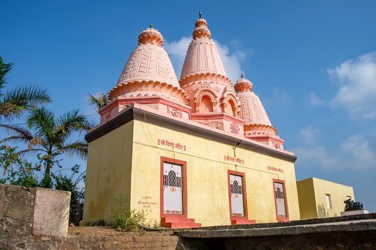 Pune, India - June 03 2023: Hindu Temple at Tulapur near Pune India. Inscription translations reads from left to right "Shri VishnuTemple", "Shri Ram Temple" and 'Shri Rameshwar Temple".