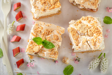 Top view of rhubarb yeast cake served with tea.