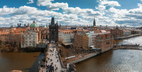 Fototapeta na wymiar Scenic spring panoramic aerial view of the Old Town pier architecture and Charles Bridge over Vltava river in Prague, Czech Republic
