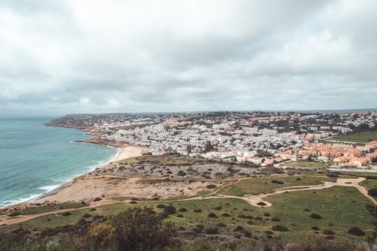 View of the city of Luz and the Atlantic Ocean beaches from the top of Atalaia hill in the Algarve region of southern Portugal. Following in the footsteps of the Fisherman Trail. Rota Vicentina