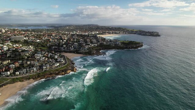 Aerial landscape panning across Bondi, Tamarama and Bronte Beach, NSW. Drone 4K