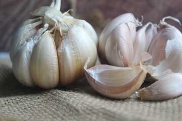 bunch of garlic on brown background