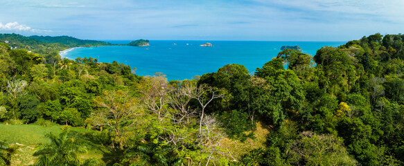 View over Wafers Bay Cocos Island Costa Rica. Aerial Drone View of a tropical island with lush...