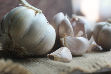 bunch of garlic on brown background