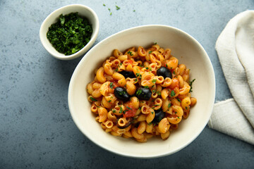 Homemade pasta puttanesca with fresh parsley