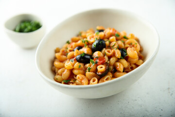 Homemade pasta puttanesca with fresh parsley