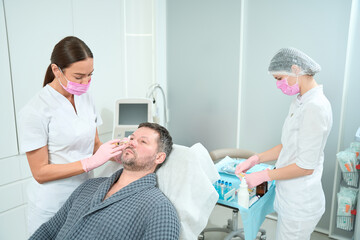 Male patient on rejuvenating plasma therapy procedure