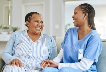 Senior woman, nurse and laughing together for support, healthcare and happiness at retirement home. Black person or patient and caregiver holding hands for trust, elderly care and help for wellness