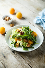 Healthy leaf salad with apricot and walnut