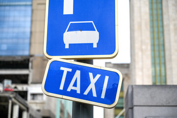 Taxi stand in the city. A traffic for a taxi stand.