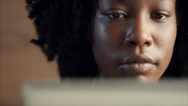 Reading, tablet and face with girl in close up for information in africa on the internet for phd. Face, read and focus on app for research or checking email for online planning for knowledge.