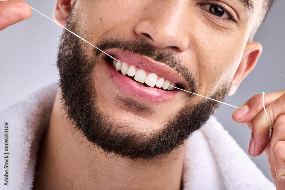 Sticker Face, man and flossing teeth for dental health in studio isolated on a white background. Portrait, floss and male model cleaning tooth for oral wellness, hygiene and healthy gums for fresh breath.