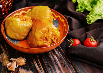 Baked bell peppers stuffed with meat, onions and rice