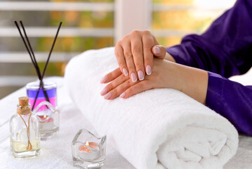 Obraz na płótnie Canvas Hand massage close-up. A girl's hand with a beautiful manicure. Beauty sphere