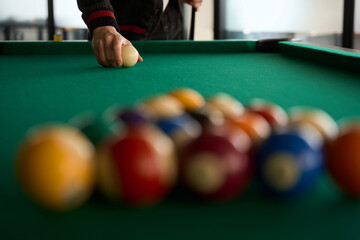 Blurred view of billiard balls on pool table