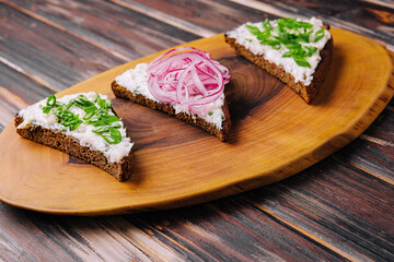 pieces of bread with delicious lard with red and green onions